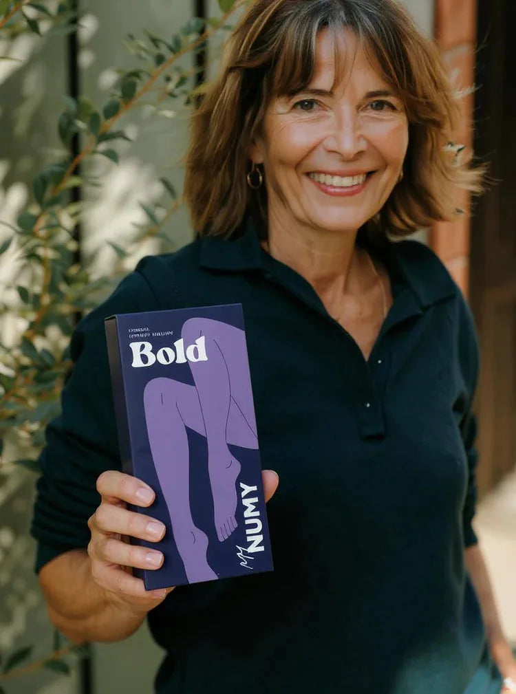 A NUMY customer holding her Bold box