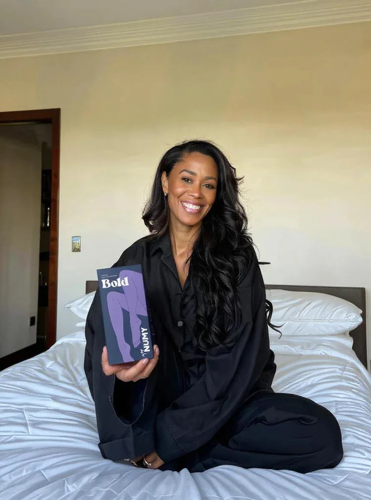 A NUMY customer holding her Bold box
