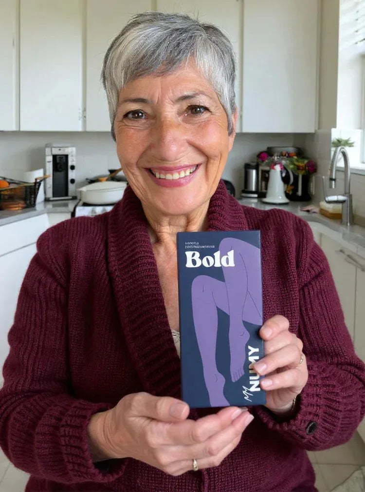 A NUMY customer holding her Bold box